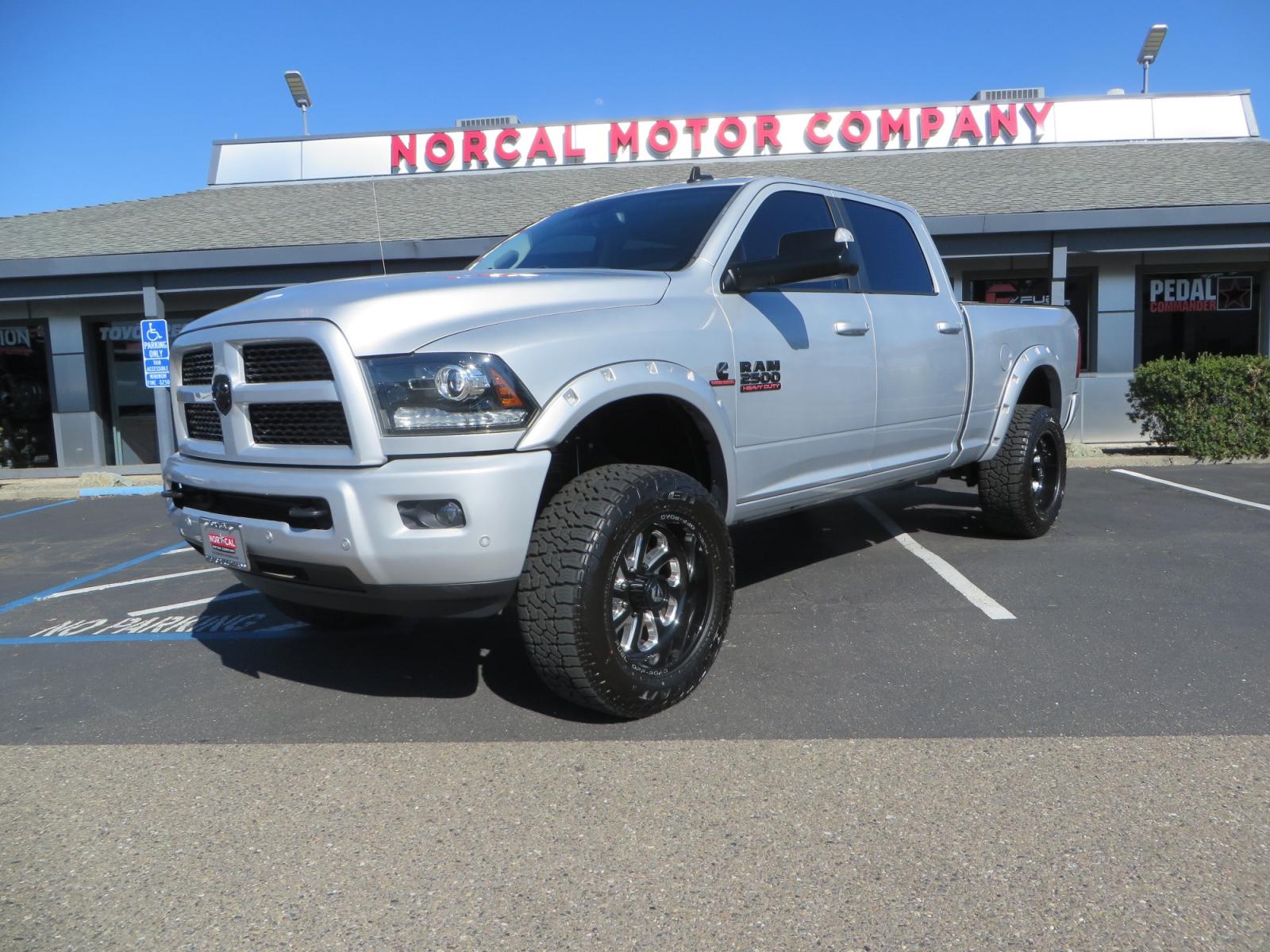 2016 SILVER /BLACK RAM 2500 Laramie Crew Cab SWB 4WD (3C6UR5FL3GG) with an 6.7L L6 OHV 24V TURBO DIESEL engine, 6A transmission, located at 2630 Grass Valley Highway, Auburn, CA, 95603, (530) 508-5100, 38.937893, -121.095482 - Leveled Ram sitting on Fuel Offroad wheels, Falken Wildpeak AT tires, Amp Power steps, Rolling Bed cover, Color matched fender flares, and window tint. - Photo #0